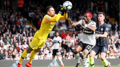 Manchester City's Ederson in action with Fulham's Ryan Babel. Reuters