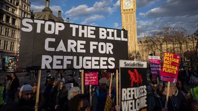 Pro-immigration campaigners protest against the proposed Illegal Migration Bill outside the Houses of Parliaments in London. EPA