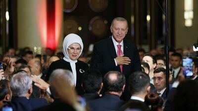 Turkish President Recep Tayyip Erdogan and his wife his wife Emine greet guests during his oath ceremony in Ankara. AFP