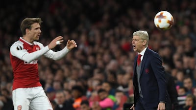 Arsene Wenger, right, the Arsenal manager, is frustrated his side head to Spain next week for the second leg of their Europa League semi-final with Atletico Madrid level at 1-1. Mike Hewitt / Getty Images