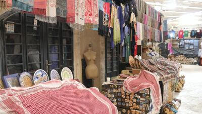 Souvenir shops a the Jerash visitors center, normally bustling with tourists and vendors during Jordan’s fall-winter high season, are shuttered and covered in tarps and shmaghs mid-day in Jerash, northern Jordan, on October 21, 2020