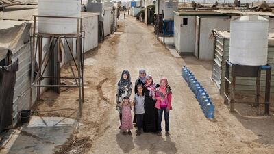 Amal Al Hoshan stands with her children in Za’atari refugee camp in Jordan. Next to them are 15 large plastic containers bearing 300 litres of water, the amount the family uses daily. Installed outside their home is a Unicef-provided water tank that holds two cubic metres of water, available for the entire street to use. “People who live in houses use less because a house is clean,” says Ms Al Hoshan. “In the camp, it is dirty and dusty. We need to clean a lot. My baby doesn’t sleep on a mattress, for example; she sleeps on the concrete floor because it’s cooler.” Courtesy Unicef