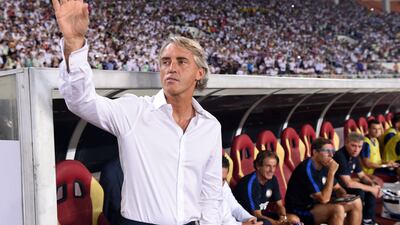 Inter Milan’s head coach Roberto Macini awaits the International Champions Cup football match between Inter Milan and Real Madrid in Guangzhou on July 27, 2015. AFP PHOTO / JOHANNES EISELE