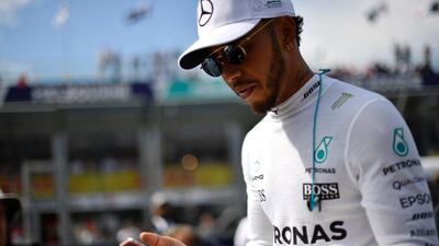 Mercedes' British driver Lewis Hamilton takes part in the drivers parade prior to the start of the Formula One Australian Grand Prix in Melbourne on March 26, 2017. Saeed Khan / AFP