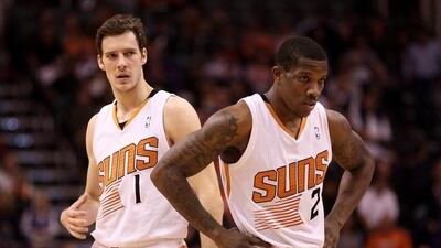 Eric Bledsoe, right, signed a five-year contract extension with Phoenix on Wednesday. Christian Petersen / AFP