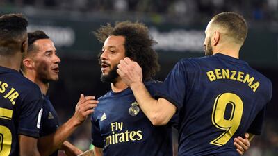 7. Real Madrid - 3741 points. Striker Karim Benzema (R) celebrates with his teammates. EPA