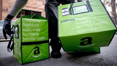 An Amazon worker delivers groceries from the Amazon Fresh service in the Brooklyn Borough of New York. The service has just been launched in parts of London. Brendan McDermid/Reuters