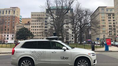 An Uber car equipped with cameras and sensors drives the streets of Washington. The company agreed to sell its autonomous car division to Aurora in a deal that gives the ride-hailing giant a stake in the start-up. AFP