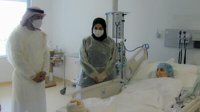 Ali Saeed Al Neyadi, chairman of the National Emergency Crisis and Disaster Management Authority, visits Iman Al Safaqsi at a hospital in Abu Dhabi. Photo: Wam