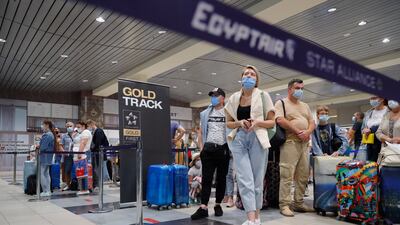Passengers wait to check in at Domodedovo International Airport outside Moscow for the first flight from Russia to Egypt's Red Sea region in six years. AP