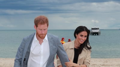 Meghan, Duchess of Sussex, wears a Club Monaco dress and Martin Grant coat in Melbourne on October 18, 2018. Reuters