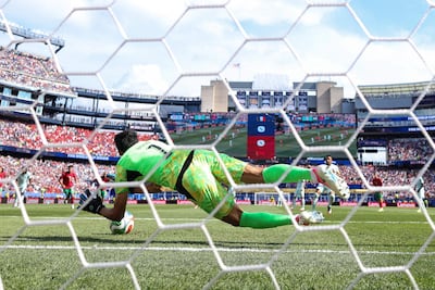 Morocco goalkeeper Yassine Bounou saves Kylian Mbappe's first-half penalty. AFP