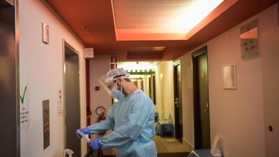 A doctor visits a patient at the Living Place Hotel. Getty Images