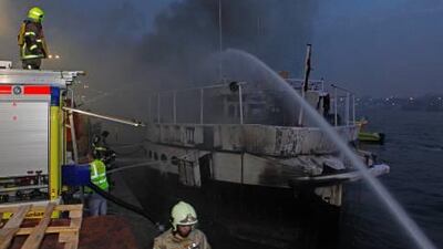 :Rescue crews pulled survivors from the water as firemen battled flames that engulfed two vessels in Dubai Creek last night.