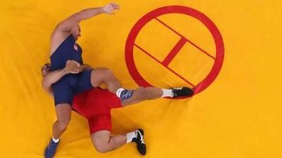 After their sport was excluded in February, Olympic wrestlers Ioseb Chugoshvili, right, of Belarus and Poland’s Lukasz Banak will be able to compete again in 2020 when the Games come to Tokyo. Ian Walton / Getty Images