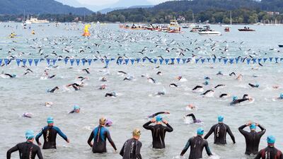 Competitors take the swim during the ironman triathlon in Klagenfurt, Austria. Johann Groder / AFP