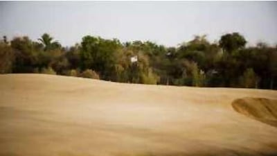 The 12th hole at the tough Al Ghazal sand golf course. Al Ghazal is located near the Abu Dhabi Airport .