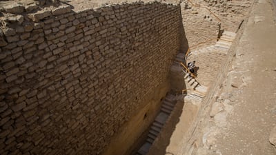 A man walks down the stairs towards the southern cemetery of King Djoser. AP Photo