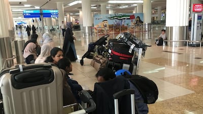 Indian passengers wait for their flight at the departure lounge at Dubai International Airport. Karim Sahib / AFP