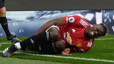 United's Paul Pogba after picking up a knock during the game. Reuters