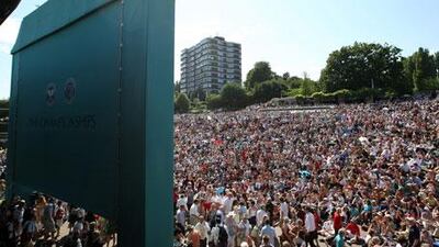 Spectators set up on Murray Mound at the All England Lawn Tennis and Croquet Club to watch their new hero, Andy Murray.