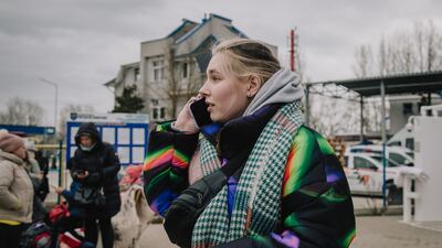 Natasha, 25, waits on the Moldovan side of the border to ensure her boyfriend, who is French, is allowed to cross.