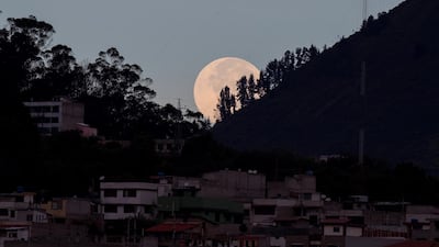 The pink supermoon looms on the horizon in Quito, Ecuador. EPA