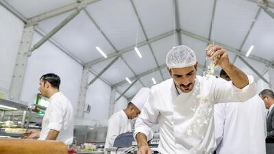 Chefs are recruited from Egypt to make fatayer. They whirl thin pieces of dough into the air and fold them with cheese and salt before they hit the oven and are then shipped out to guests. Victor Besa / The National