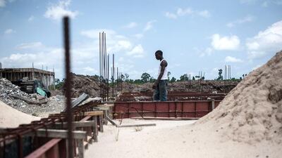 A man walks through the shut down construction site of the Nigerian Maritime University. Stefan Heunis/AFP