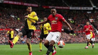Manchester United's Anthony Martial takes on Watford's Etienne Capoue. Reuters
