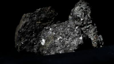 Pieces of lithium in an ore sample. Lithium is the lightest metal on Earth and is a key component in electric vehicle batteries. AP