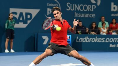 Roger Federer returns a shot to Milos Raonic during the final of the Brisbane International on Sunday. Dave Hunt / EPA