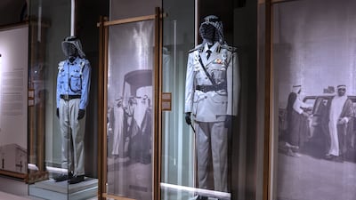 Zayed the First Regiment uniform, left, and Abu Dhabi Defence Force officer's uniform