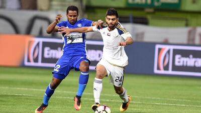Abdulrahim Ahli of Al Wahda, right, holds off Ahmed Khamis of Al Nasr during their Arabian Gulf League game, but Al Nasr still won on the night. Courtesy Arabian Gulf League