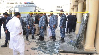 Security forces work at the site of a deadly blast claimed by the Islamic State group that struck worshippers attending Friday prayers at a Shiite mosque in Kuwait City. AP Photo