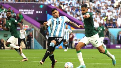 Saleh Al Shehri, right, scores his team's opening goal. EPA
