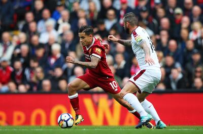 Philippe Coutinho, left, in action for Liverpool during the 1-1 draw with Burnley. Alex Livesey / Getty Images