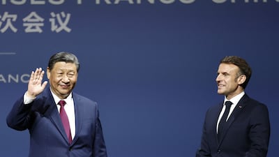 Mr Xi and Mr Macron at the Franco-Chinese Business Council event. AFP