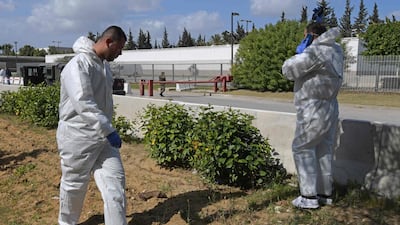 Forensic experts inspect the scene of an explosion near the US embassy in the Tunisian capital Tunis. AFP