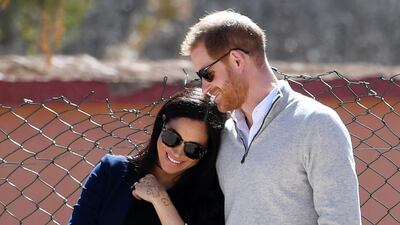Meghan, Duchess of Sussex and Prince Harry watch students play football during a visit to Lycee Qualifiant Grand Atlas school on February 24, 2019 in Asni, Morocco. Getty Images