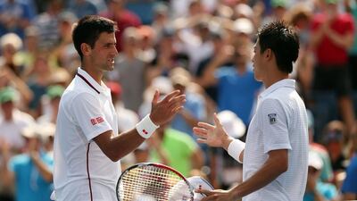 Kei Nishikori greets Novak Djokovic at the end of their men’s singles semi-final match after the Japanese defeated his fancied Serb rival in four sets 6-4, 1-6, 7-6, 6-3. Matthew Stockman / Getty Images