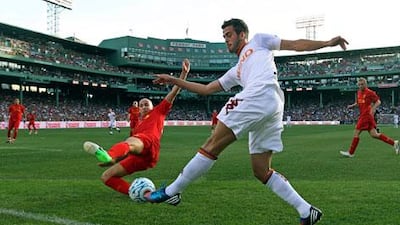 JonJo Shelvey slides on on Roma's Miralem Pjanic at Fenway Park