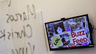 A television monitor displays BuzzFeed content in the company’s office in New York. Shannon Stapleton / Reuters