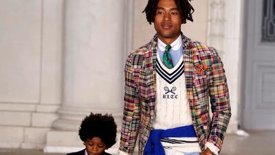 A little boy in bright green trousers stole the moment by insisting on high-fiving everyone he passed. AP