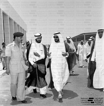 UAE Founding Father, the late Sheikh Zayed bin Sultan Al Nahyan, visits the Armed Forces building in 1971 with Maj Gen Awad Mohammed Al Khalidi, far left. Photo: National Archives and Library of the UAE