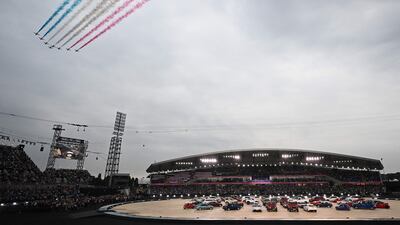 The Red Arrows, the Aerobatic Team of Britain's Royal Air Force, fly over the stadium. AFP