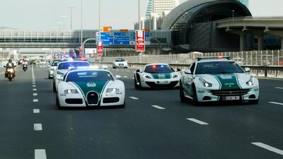 A fleet of Dubai Police supercars led the way during the fourth stage of the Dubai Tour cycling race in 2014. Christopher Pike / The National