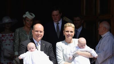Prince Albert II of Monaco and Princess Charlene, in a Dior shirt and top, attend the christening of their children, Princess Gabriella and Prince Jacques of Monaco on May 10, 2015 in Monaco. Getty Images