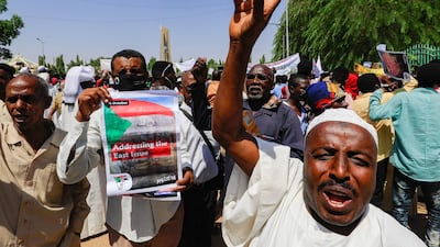 Sudanese protesters outside the presidential palace in Khartoum. AFP
