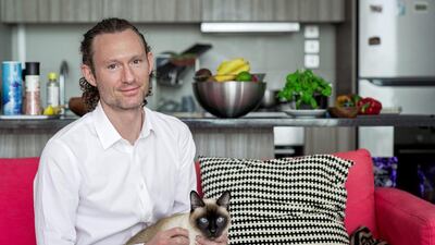 Tom Crompton lives in Shams Meera with his wife and Siamese cat Willi. Provis have given them one month to get rid of their pet. Victor Besa / The National